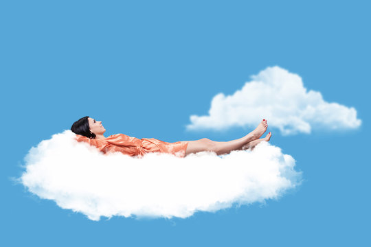 A woman sleeping on cloud