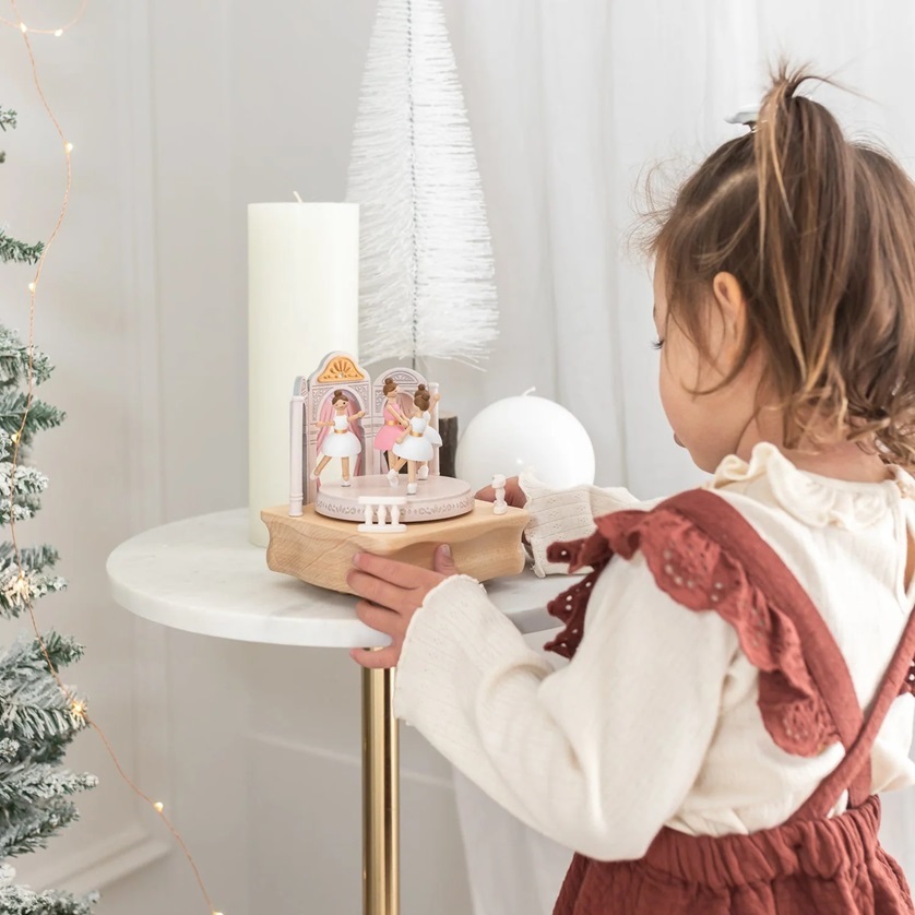 girl playing with music box 